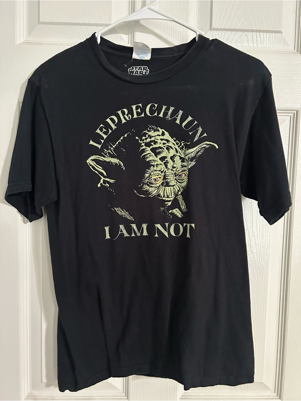 Star Wars Black Tee with Pale Green Yoda Graphic and "Leprechaun I Am Not" Text